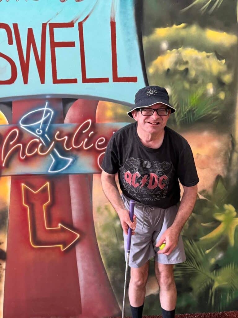 A Person in Front of a Sign — Gleam Support Services Pty Ltd in Weston, NSW