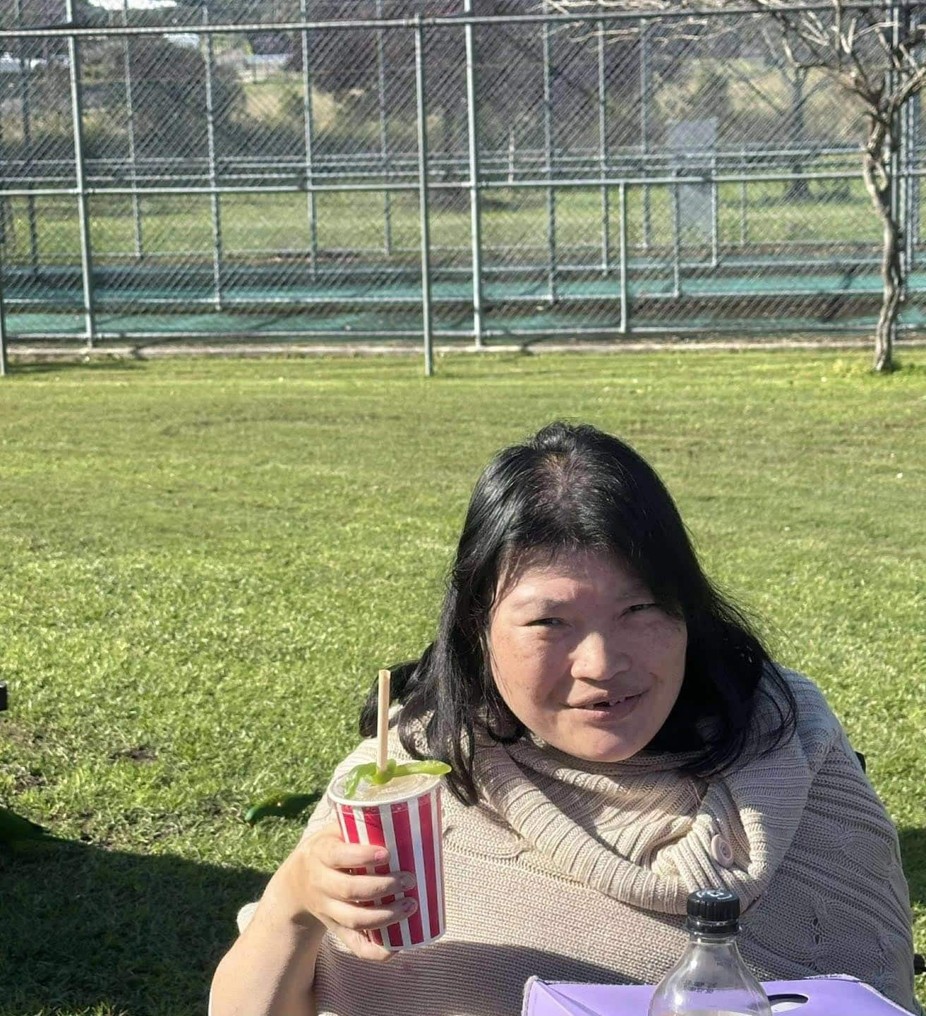 Woman Raising Her Drink Cup