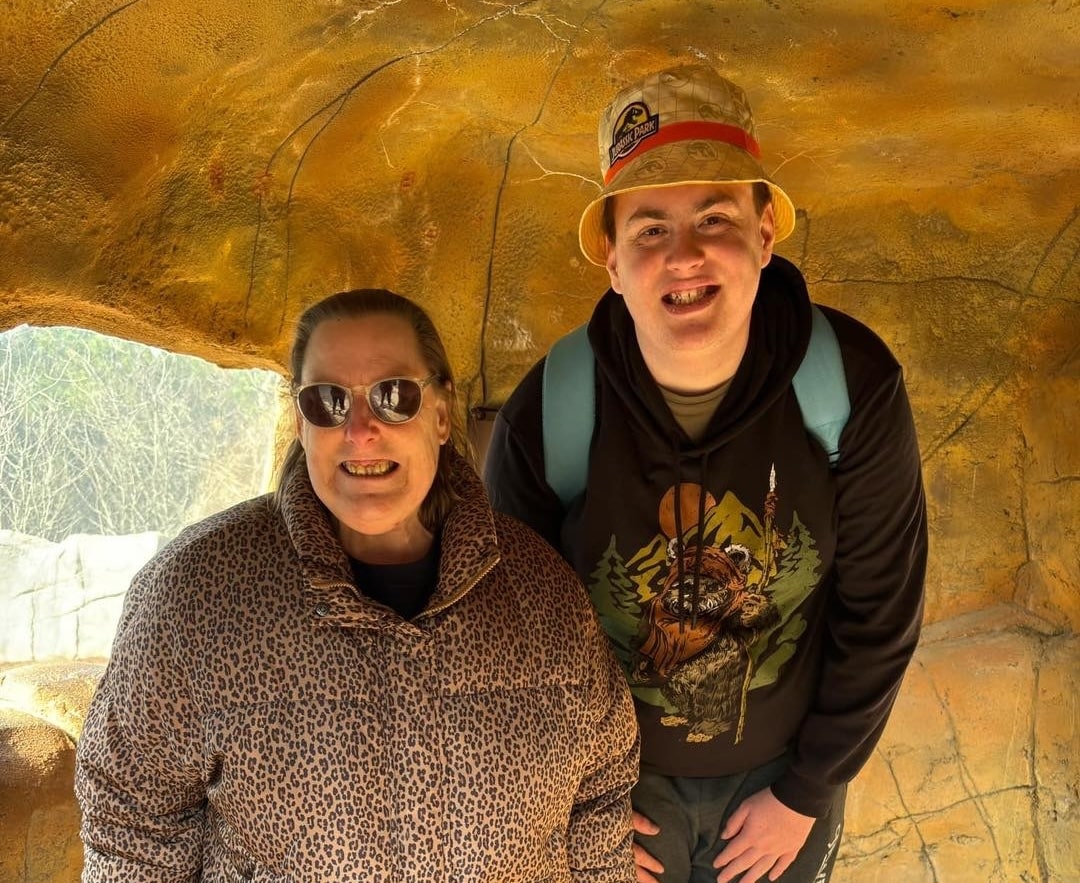Two People Smiling in a Undercover Area — Gleam Support Services Pty Ltd in Weston, NSW