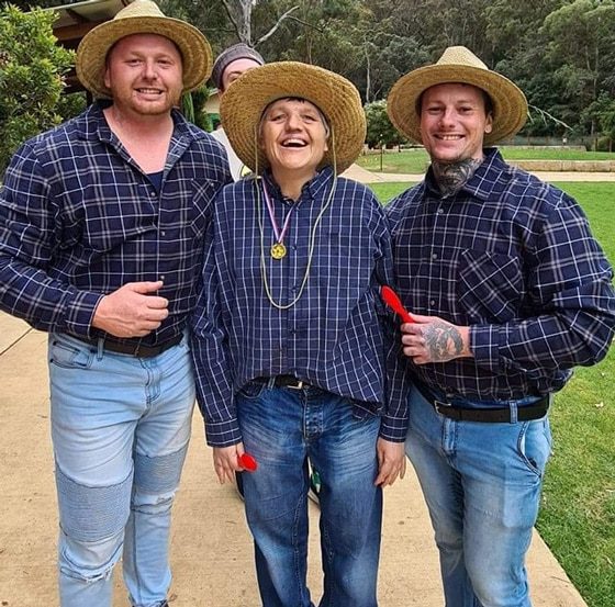 Men Wearing Plaid Long Sleeves And Woven Hat — Disability Services in Maitland, NSW