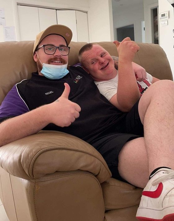 Men Sitting On Couch — Disability Services in Cessnock, NSW