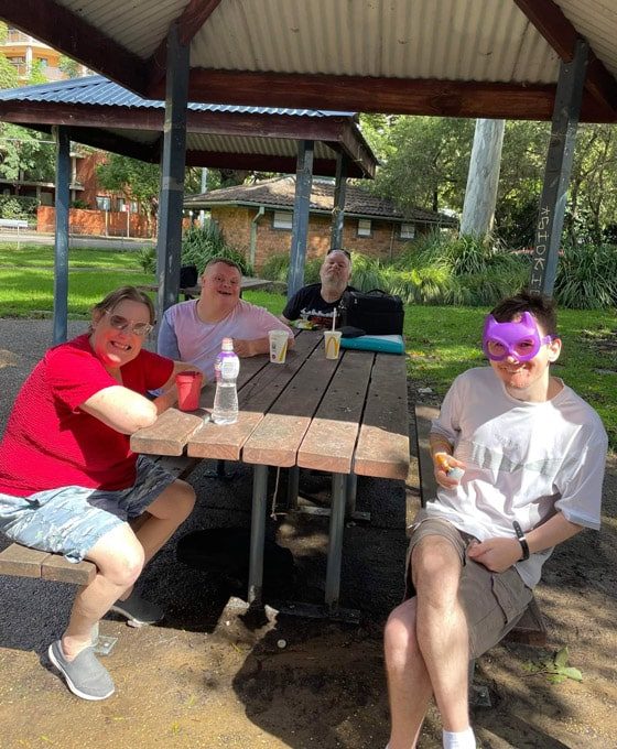 People Eating In A Park — Disability Services in Weston, NSW