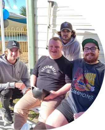 Four Men Posing On Camera — Disability Services in Weston, NSW