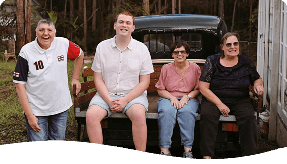 People Sitting At The Back Of A Car — Disability Services in Maitland, NSW