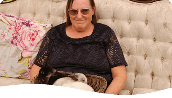 Lady Holding Bunnies In A Basket — Disability Services in Maitland, NSW