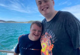 People Smiling on a Boat — Gleam Support Services Pty Ltd in Weston, NSW