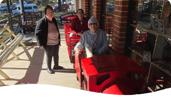 Women Outside A Store — Disability Services in Cessnock, NSW