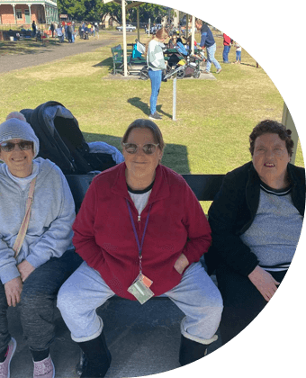 alt: Women Sitting On A Bench — Disability Services in Weston, NSW
