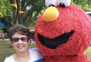 Woman With Elmo — Disability Services in Weston, NSW