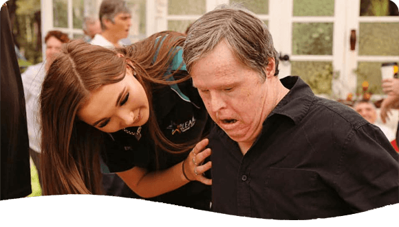 Woman Assisting A Man — Disability Services in Weston, NSW