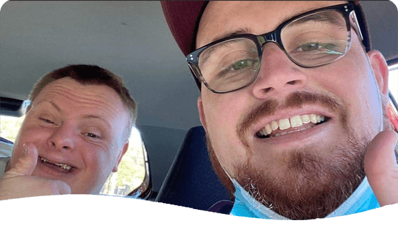 Two Men Inside A Vehicle — Disability Services in Weston, NSW